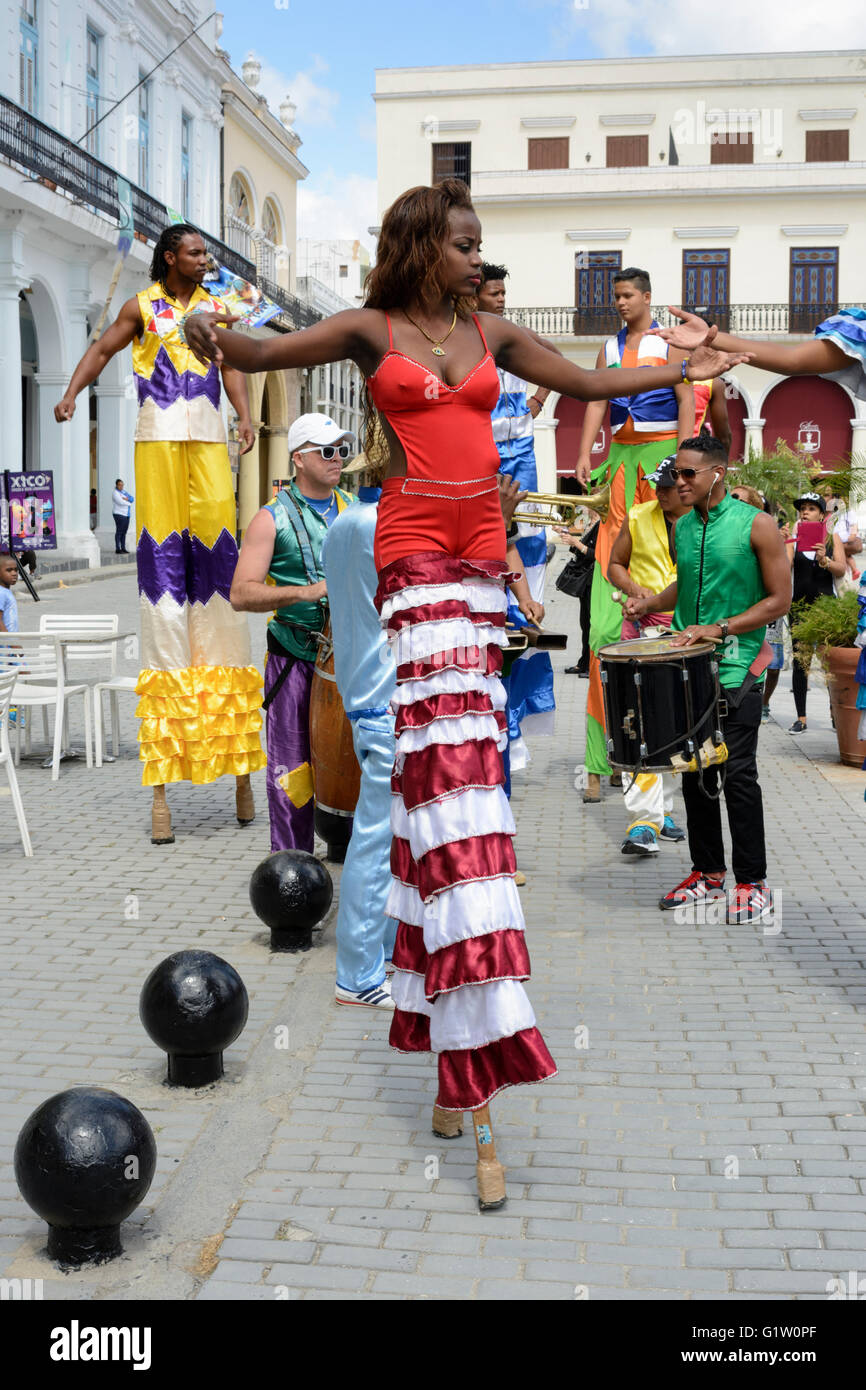 Street performers dancing on stilts in Plaza Vieja (Old Square), Habana