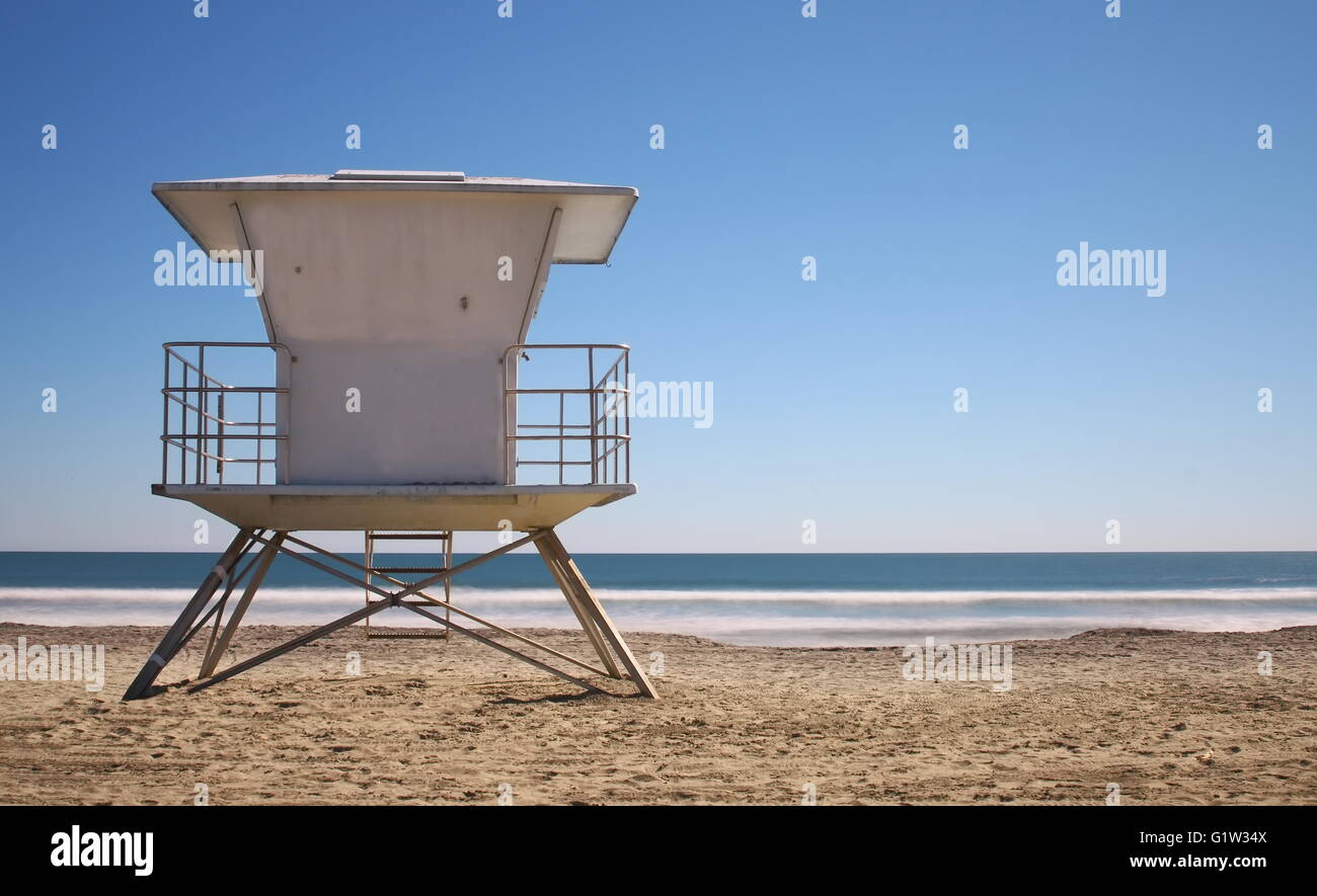 Life Guard Station - California beach with life guard tower on bright blue day with no people Stock Photo