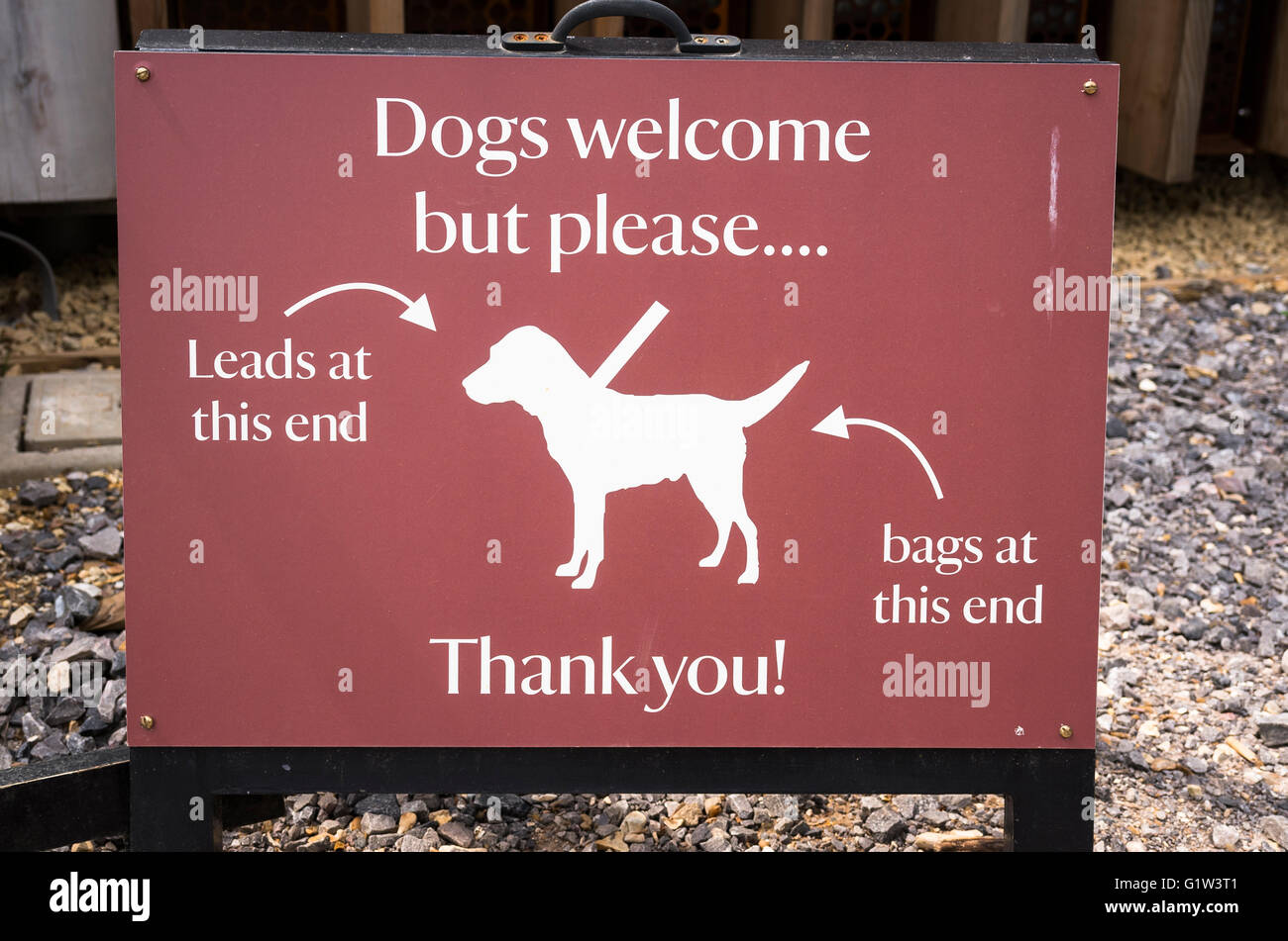 Qualified welcome notice to dog-owners visiting a  garden open to the public in UK Stock Photo