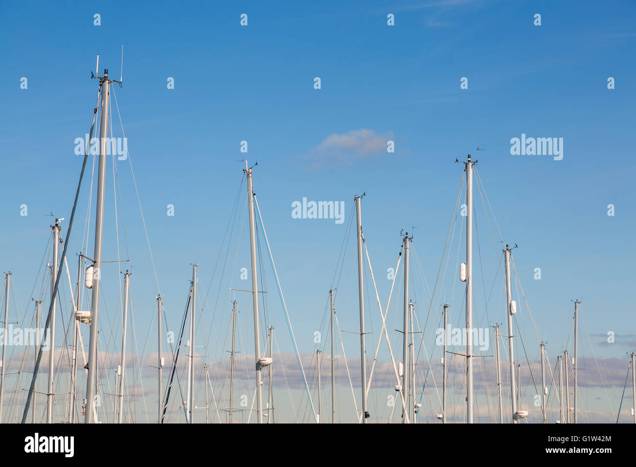 Boat sailing masts against the sky Stock Photo