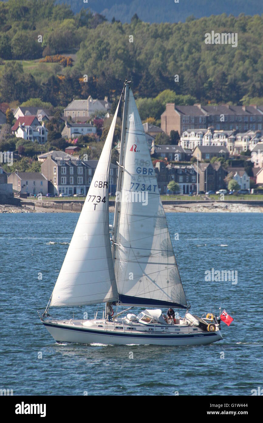 Lunar Eclipse (GBR 7734 T), a Hallberg-Rassy yacht, passing Cloch Point on the Firth of Clyde. Stock Photo