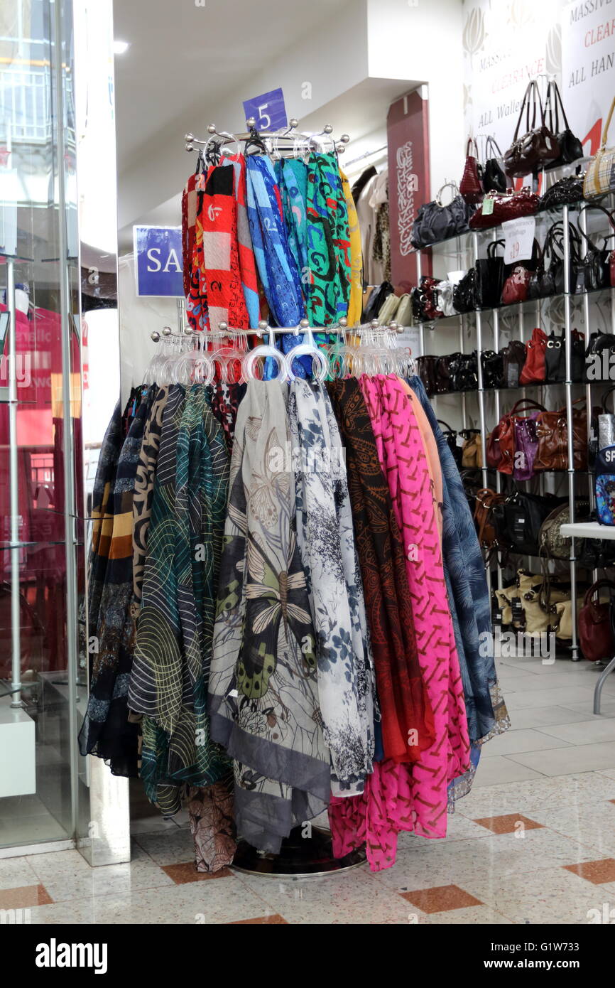 Scarves and handbags being sold at a local retail fashion store Stock Photo