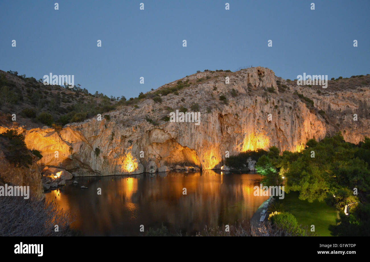 Vouliagmeni lake , Athens city , Greece . It 's a beautiful place where someone can drink coffe , eat , or swim ! Ancient cave. Stock Photo