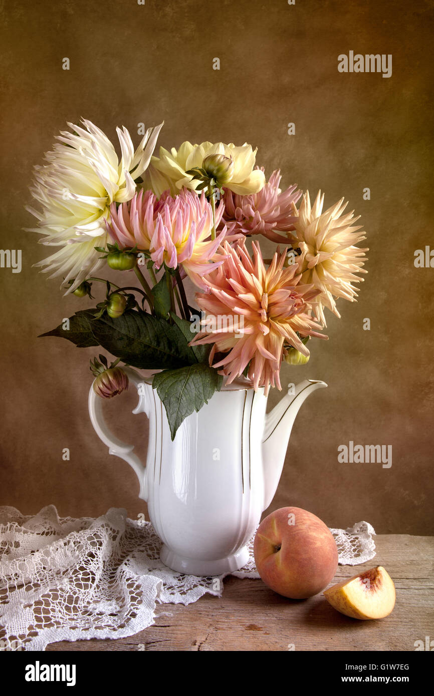 Dahlia Flowers in Vase with Peach fruit Stock Photo Alamy