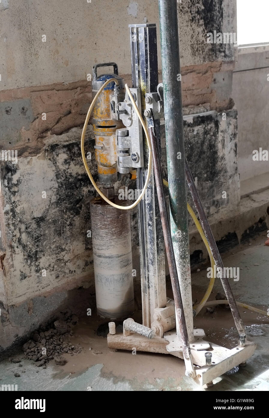 Large drill used for boring holes in concrete structures, similar to