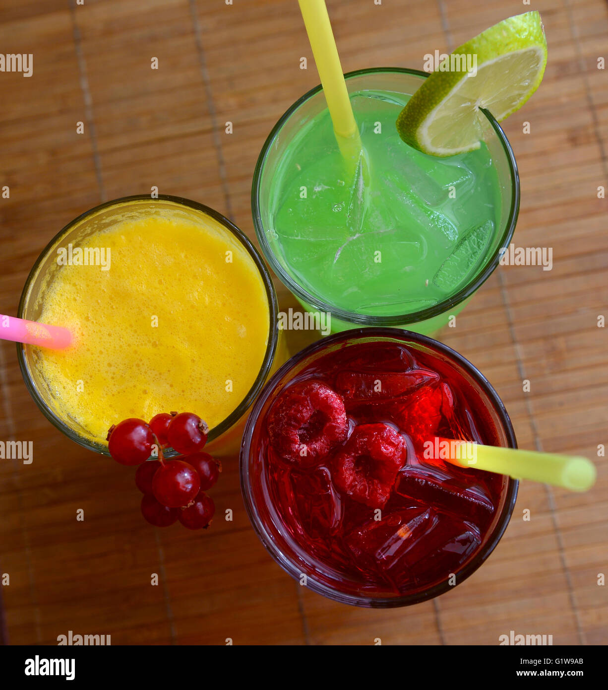 Glasses of juice, fruits  on a table Stock Photo