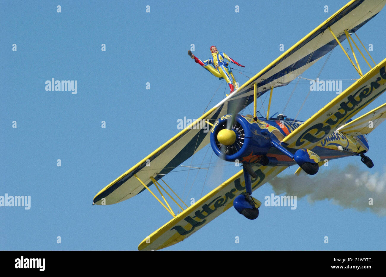 Utterly Butterly sponsored bi-plane with wing walkers at airshow Stock Photo