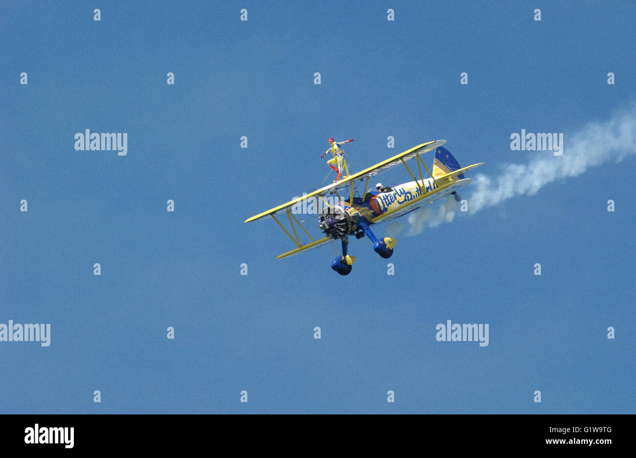 Utterly Butterly sponsored bi-plane with wing walkers at airshow Stock Photo