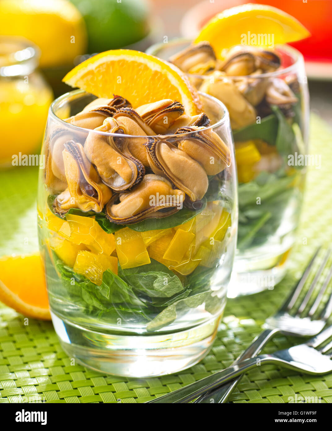 A delicious layered mussel salad with citrus vinaigrette. Stock Photo