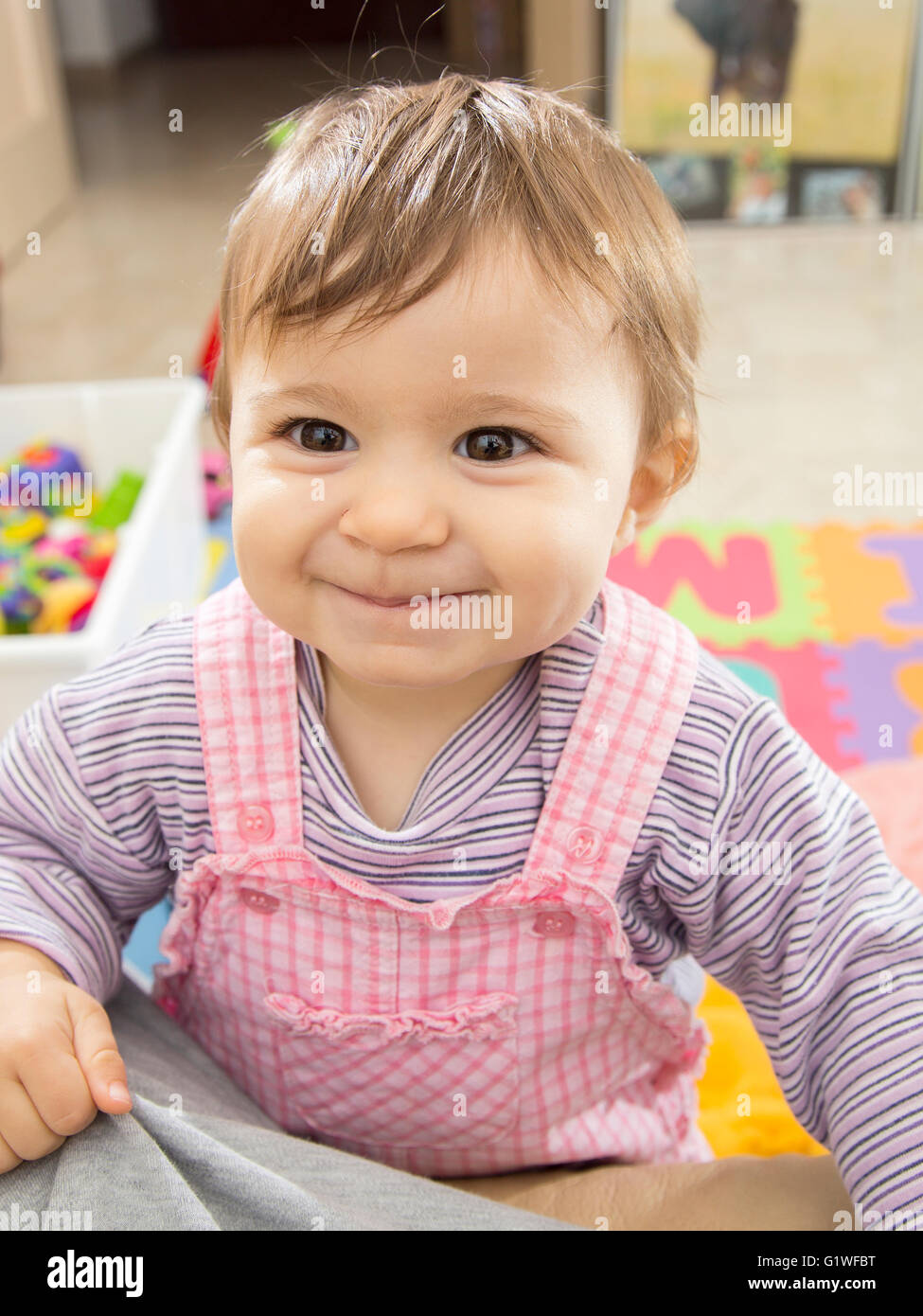 Portrait of a cute one year old baby smiling Stock Photo Alamy