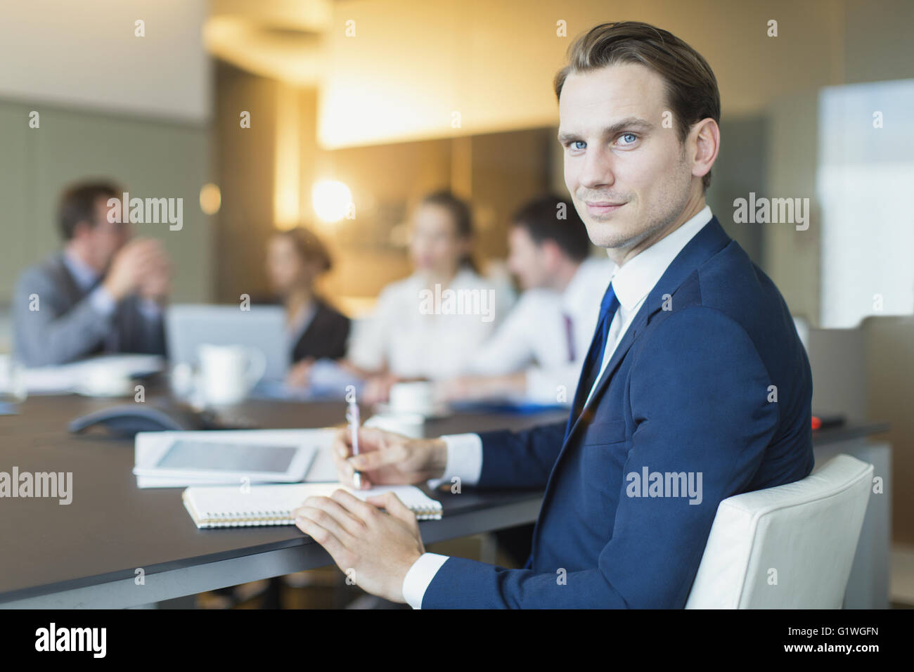 Portrait confident businessman in conference room meeting Stock Photo