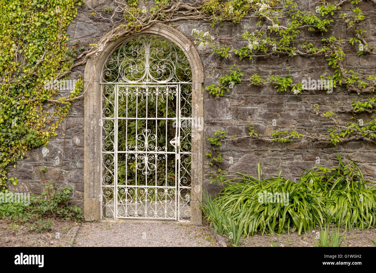 Ornate gate in The Walled Garden on Garnish Island, or Illnaculin, in Bantry Bay, Beara Peninsula, County Cork, Ireland. Stock Photo