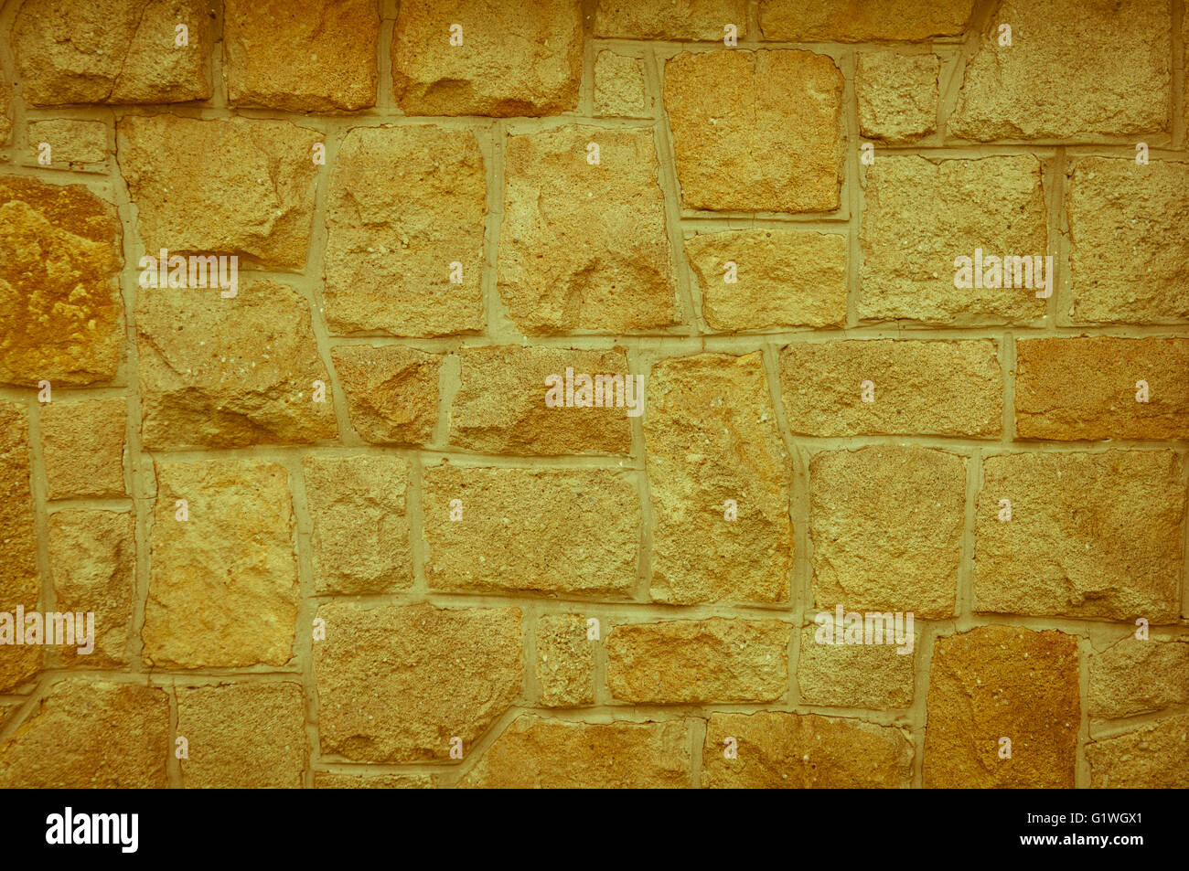 Light yellowish-brown Old stone vintage background textured Stock Photo