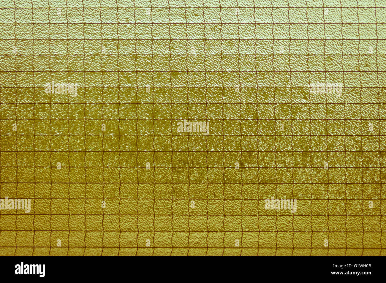 Old light yellowish-brown glass vintage background, textured Stock Photo