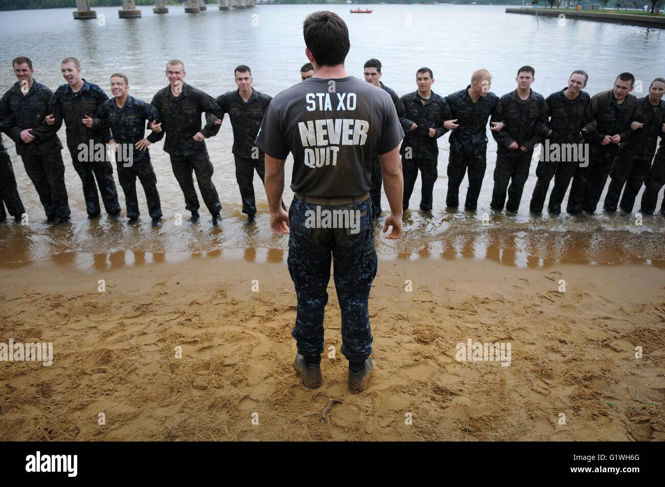 A U.S Naval Academy upperclass midshipman briefs first-year midshipmen, or plebes, participating in the U.S. Naval Academy's annual Sea Trials May 15, 2012 in Annapolis, Maryland. Stock Photo