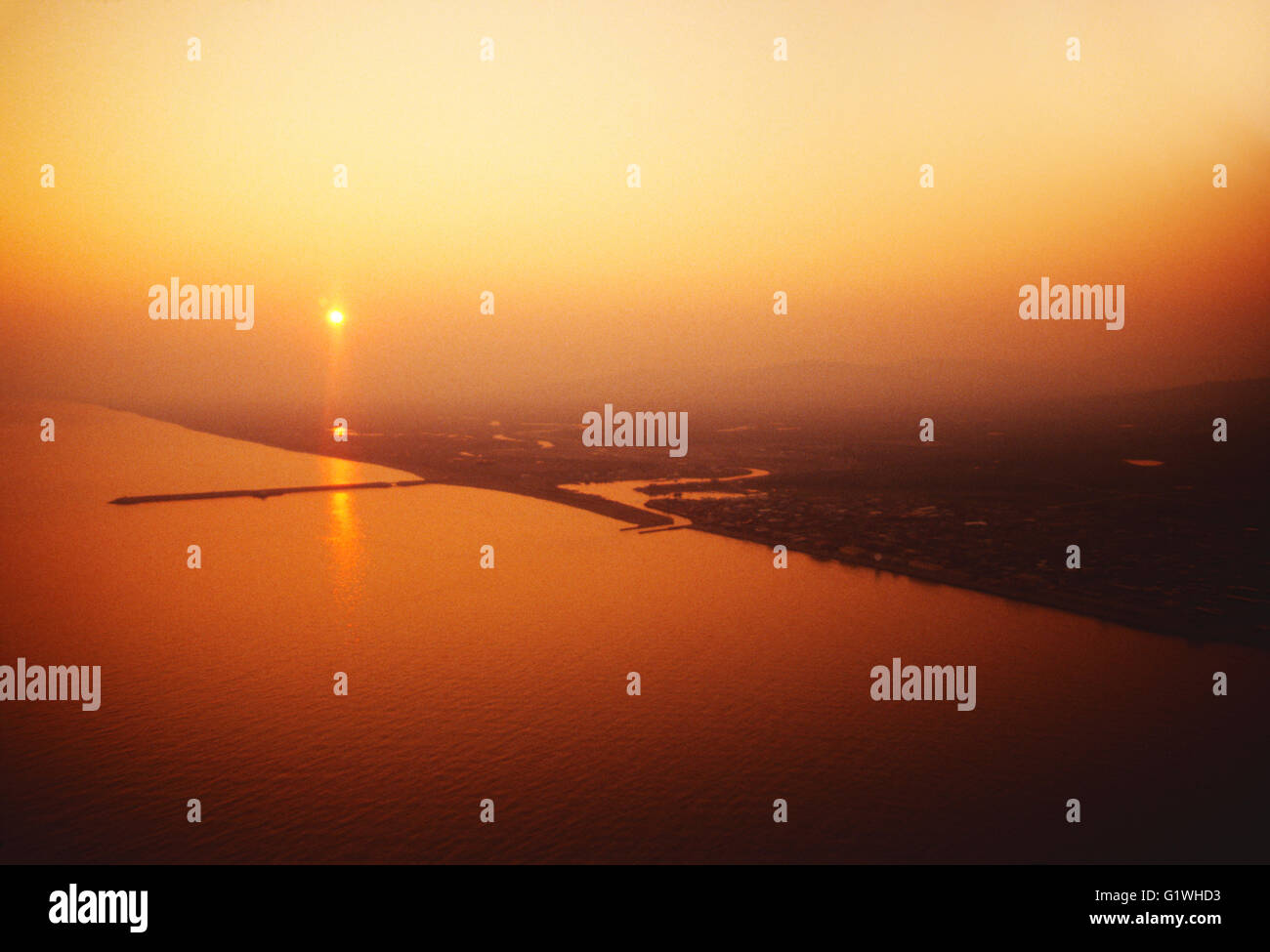 Sunset view of Bering Sea and Nome Alaska from charter Bering Air flight coming from Siberia