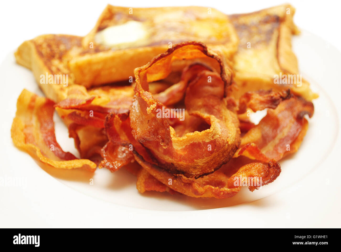 Crispy Fried Bacon with French Toast in the Background Stock Photo Alamy