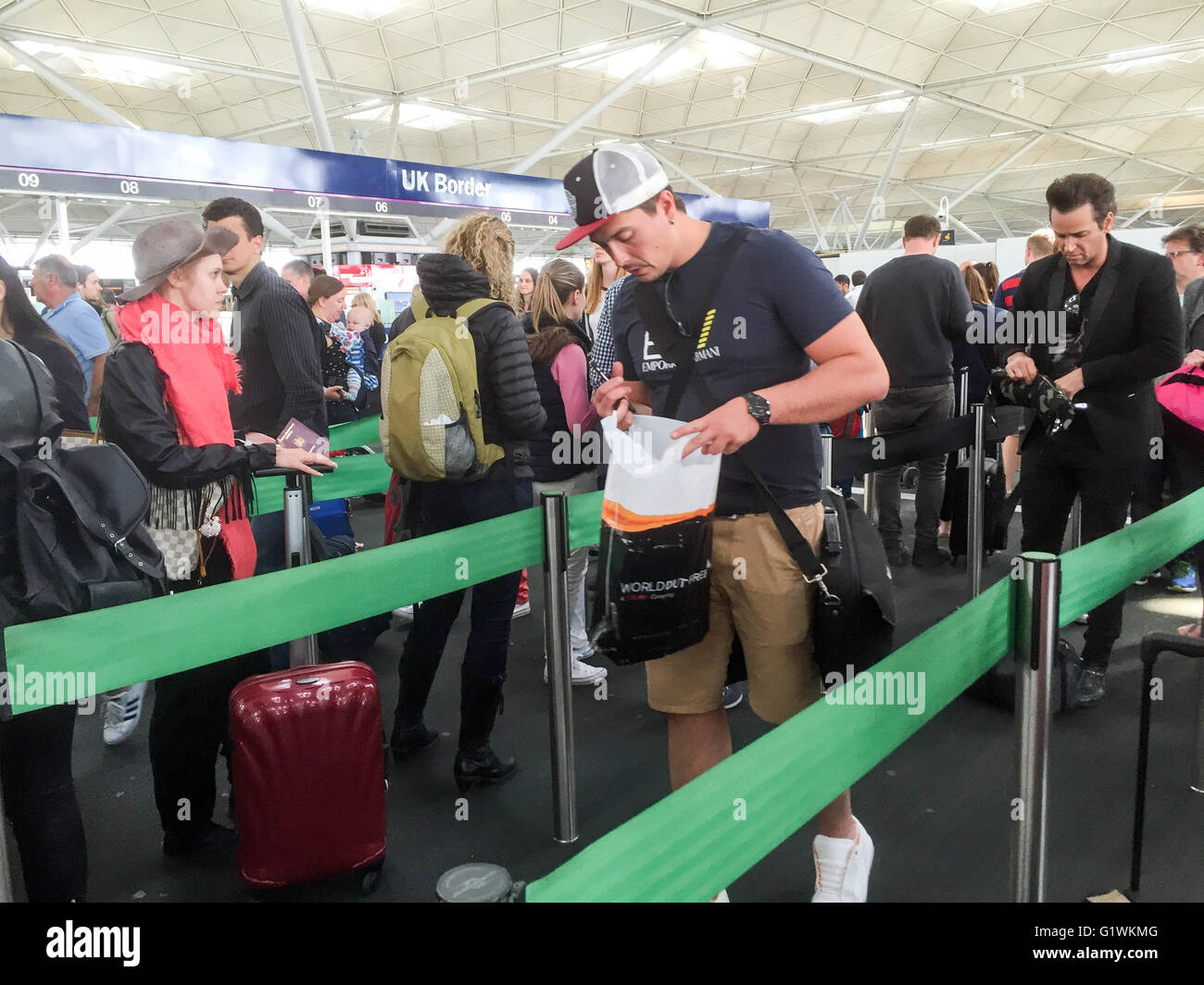 Passengers queuing for passport control at
