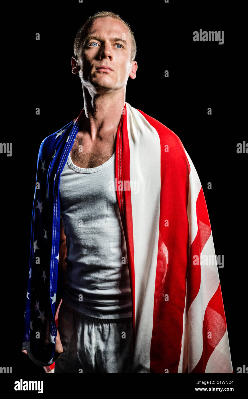 Athlete with american flag wrapped around his body Stock Photo - Alamy