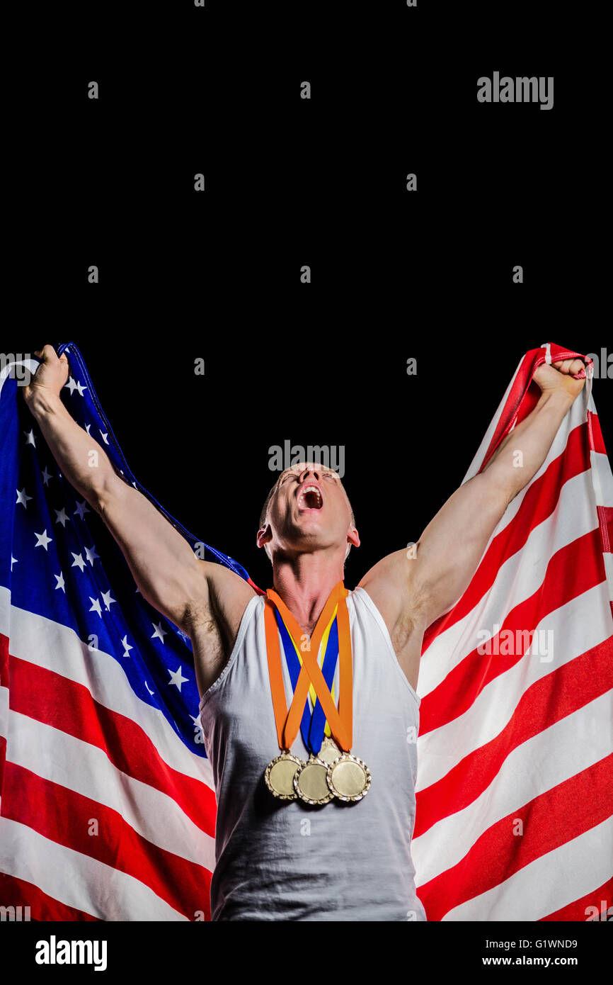 Athlete posing with gold medals after victory Stock Photo - Alamy