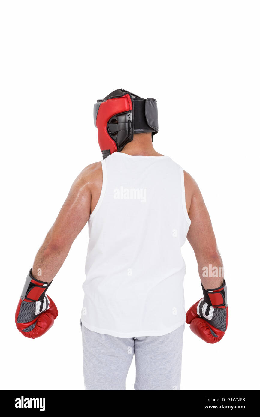 Boxer wearing head protector and gloves Stock Photo - Alamy