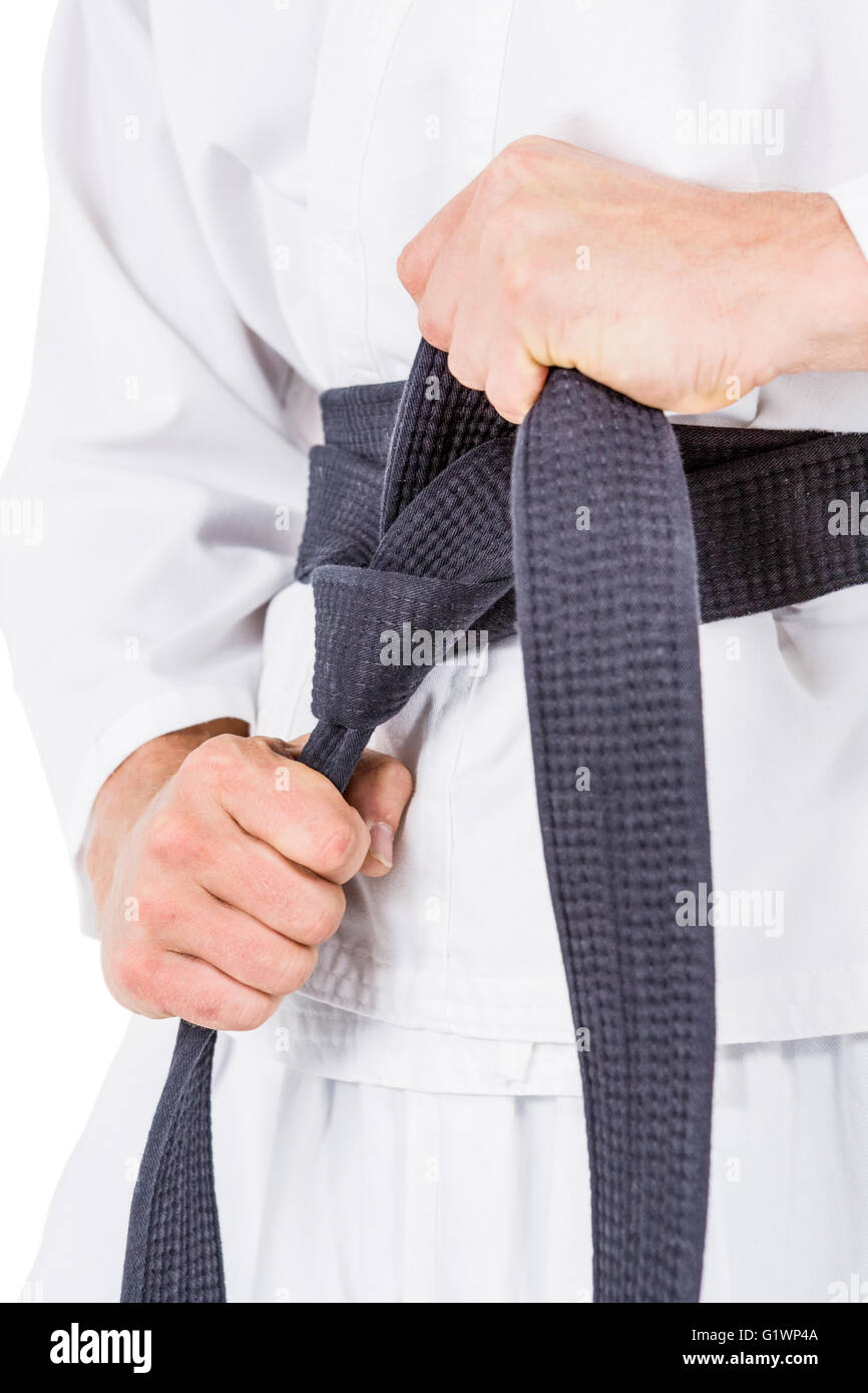 Fighter tightening karate belt Stock Photo Alamy