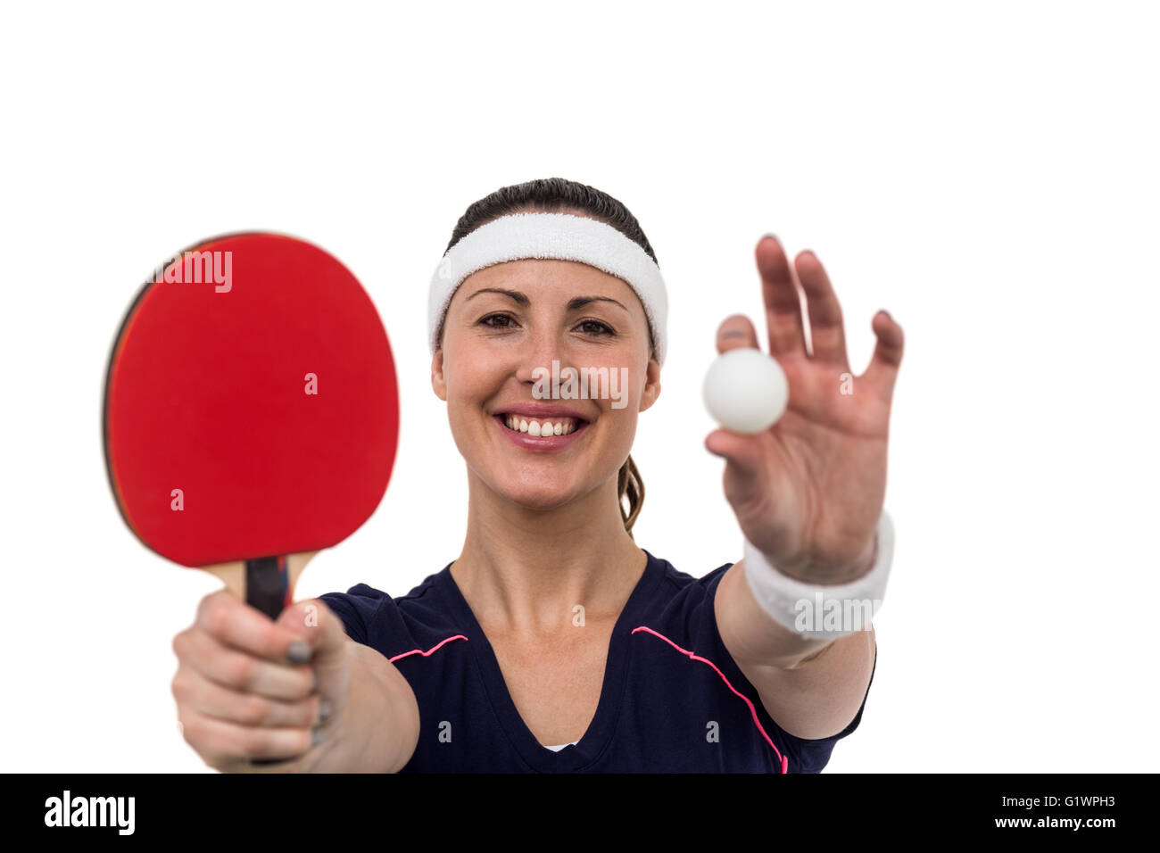 Female athlete holding table tennis paddle and ball Stock Photo