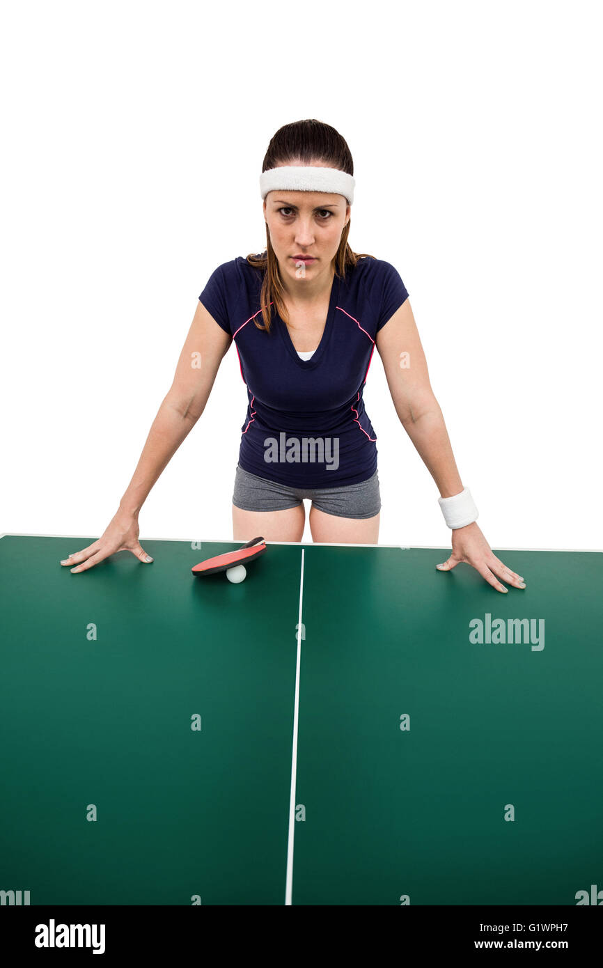 Angry female athlete leaning on hard table Stock Photo