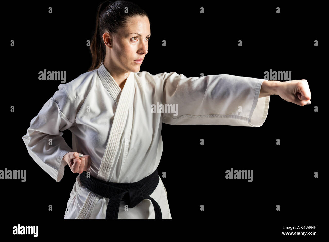 Professional female karate fighter hires stock photography and images