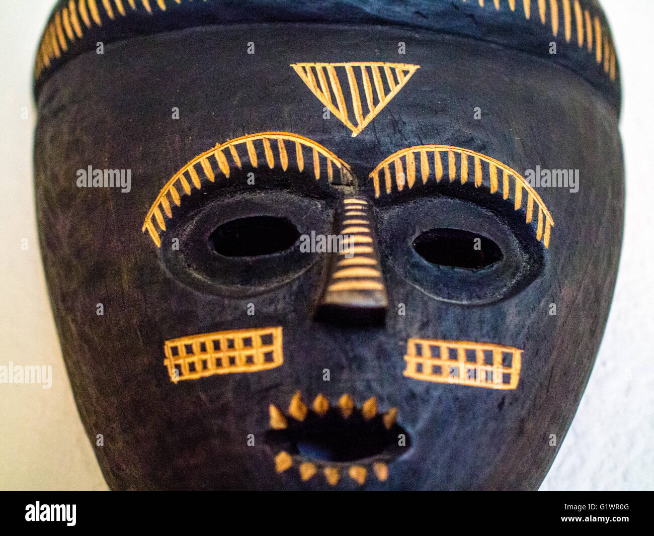 Close -up of carved African mask, black Stock Photo