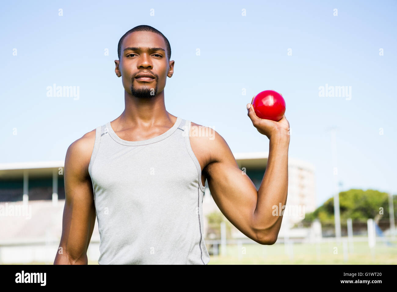 Male athlete holding shot put ball Stock Photo Alamy