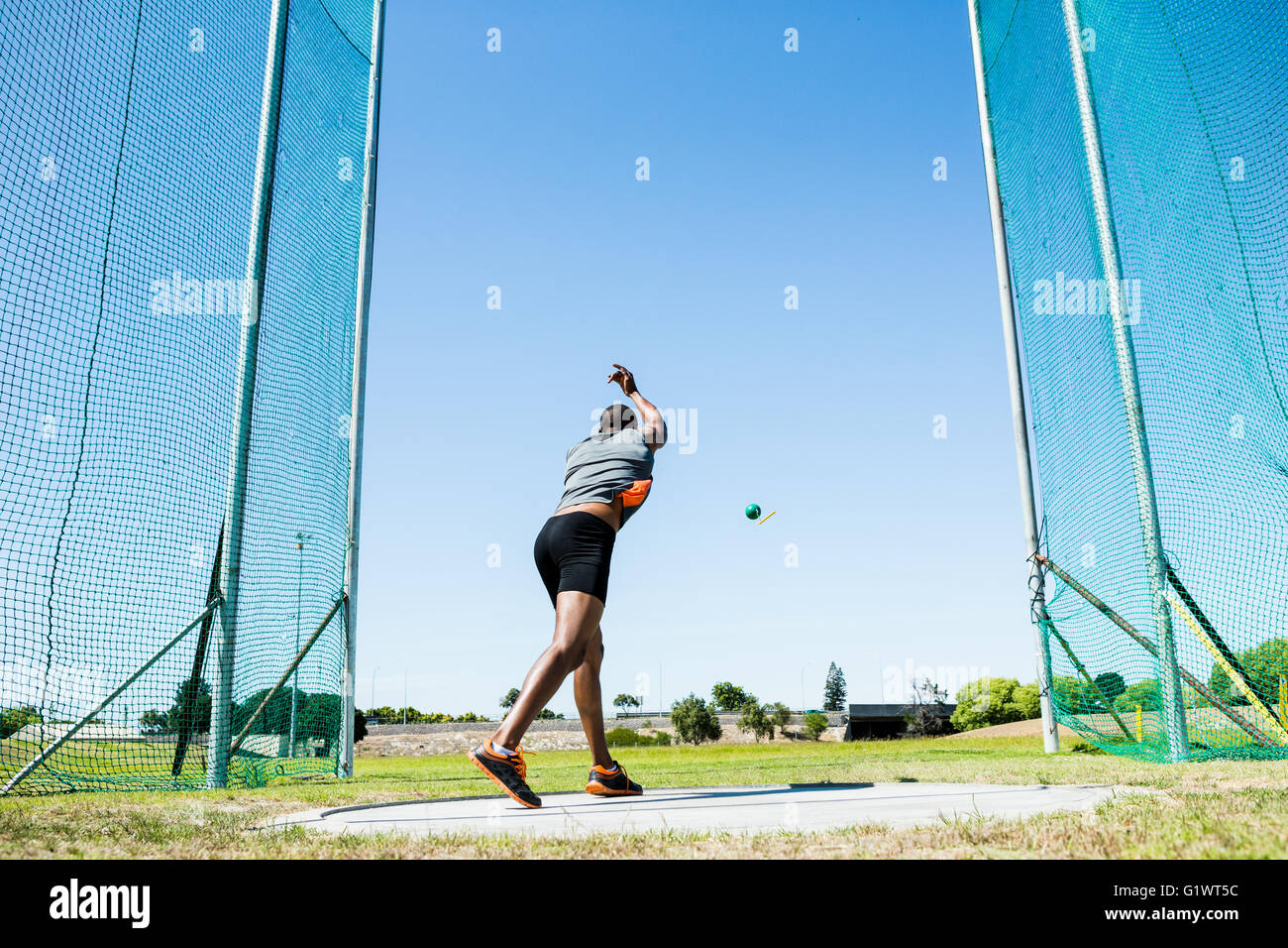Athlete performing a hammer throw Stock Photo Alamy