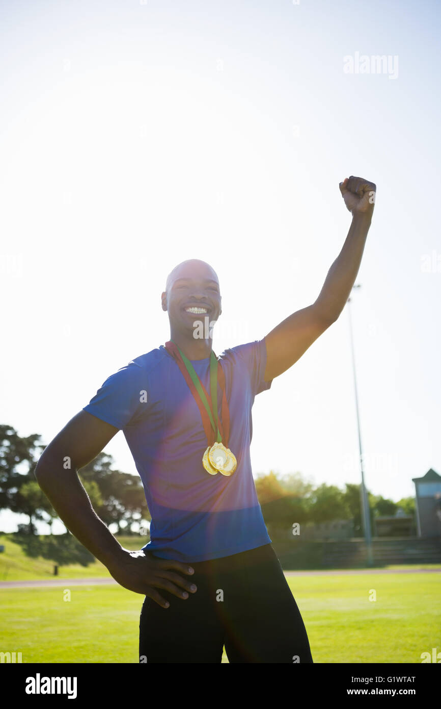 Athlete posing with gold medal after victory Stock Photo - Alamy