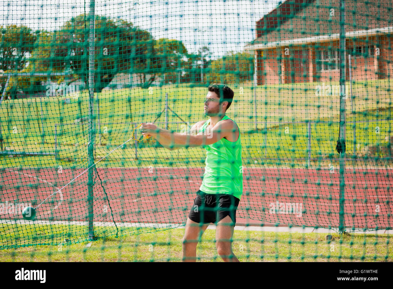 Athlete performing a hammer throw Stock Photo Alamy