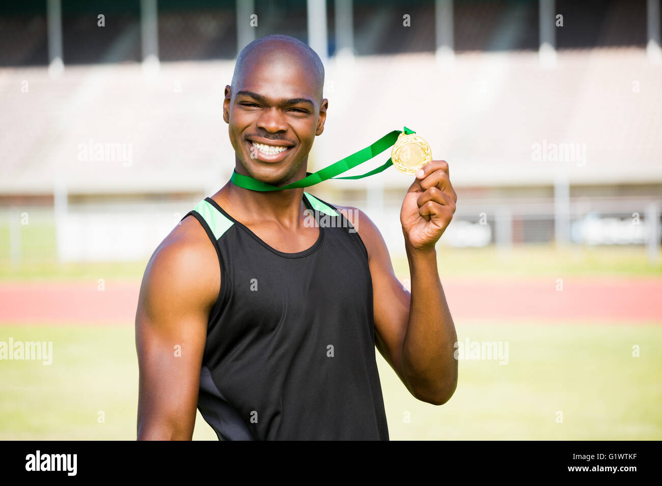 Athlete showing his gold medal Stock Photo - Alamy