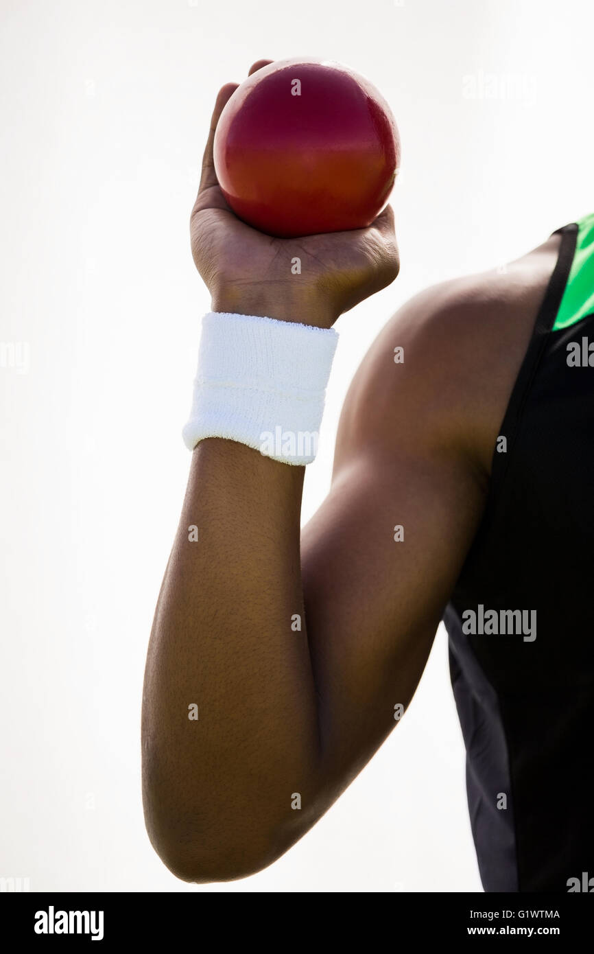 Male athlete holding shot put ball Stock Photo Alamy