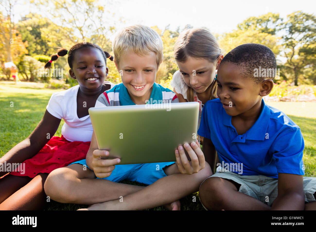 Kid S Using Technology Kids using technology during a sunny day Stock Photo - Alamy