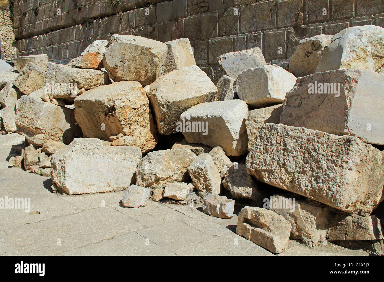 Fallen stone blocks from a section of the wall surrounding the Temple mount (Wailing wall) which was destroyed by roman soldiers Stock Photo