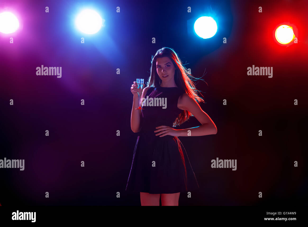 The beautiful girl dancing at the party drinking champagne Stock Photo ...