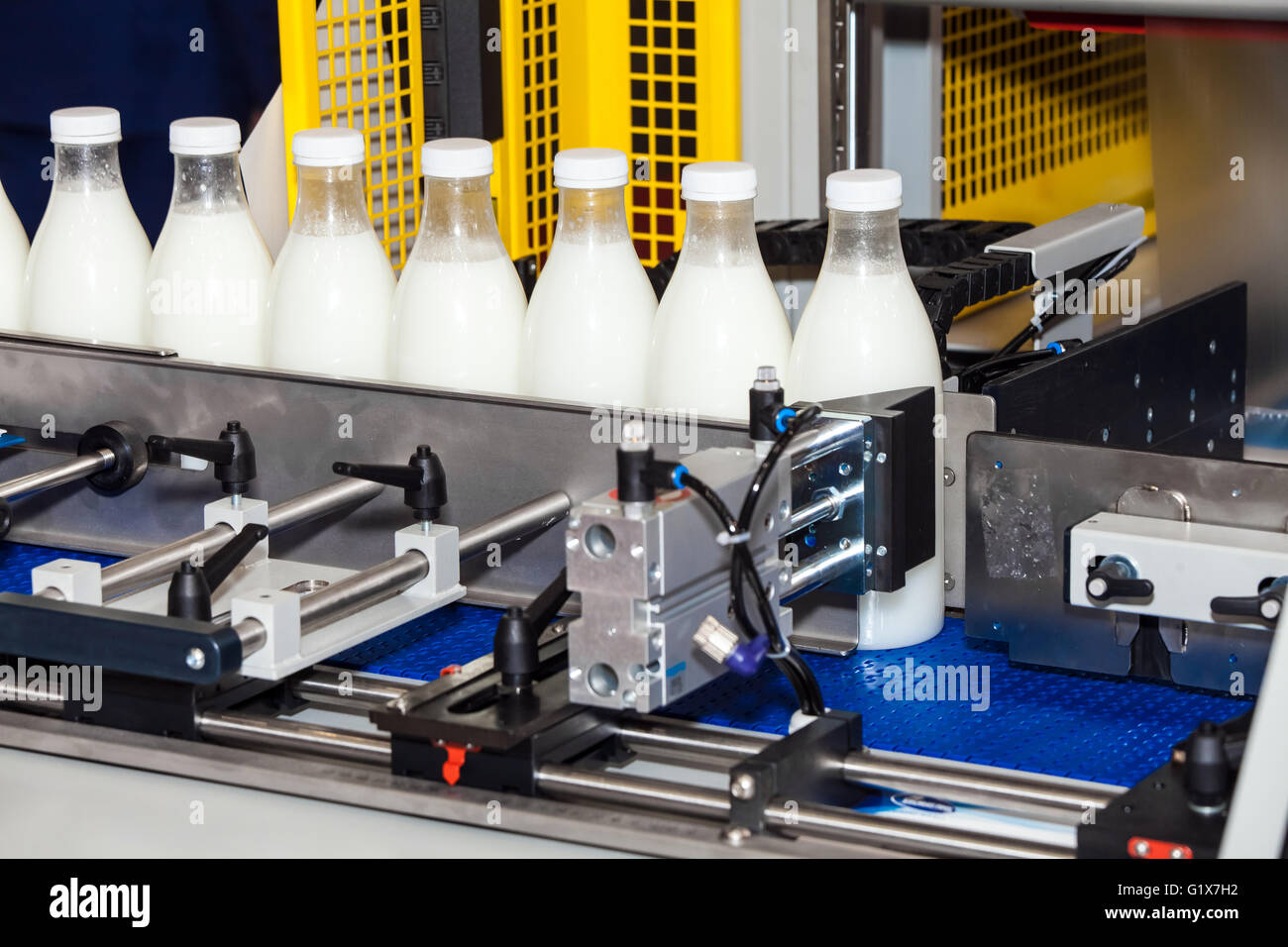 Packaging milk bottles line Stock Photo - Alamy