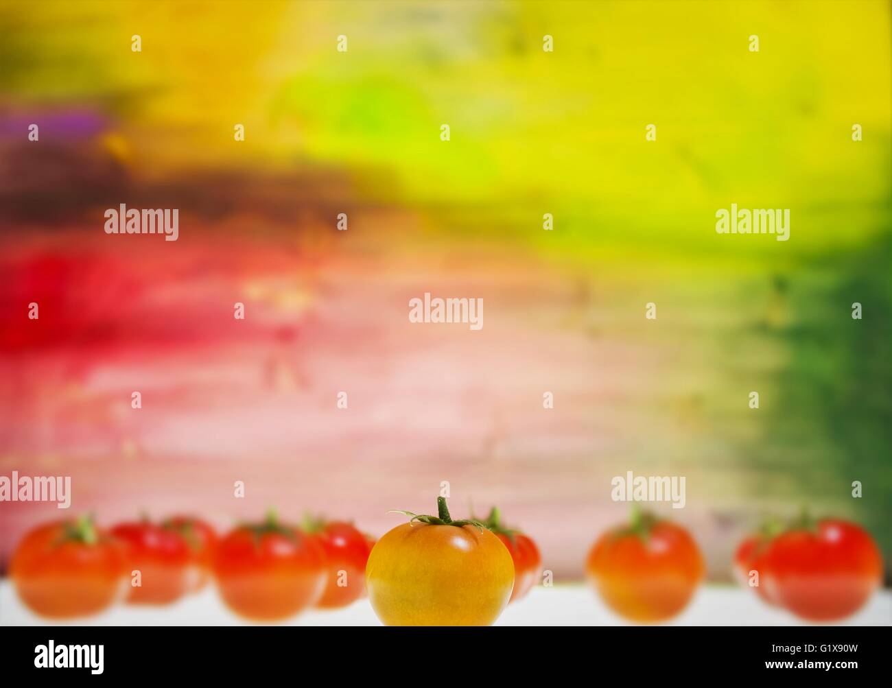 Fresh tomatoes and a colorful background Stock Photo - Alamy
