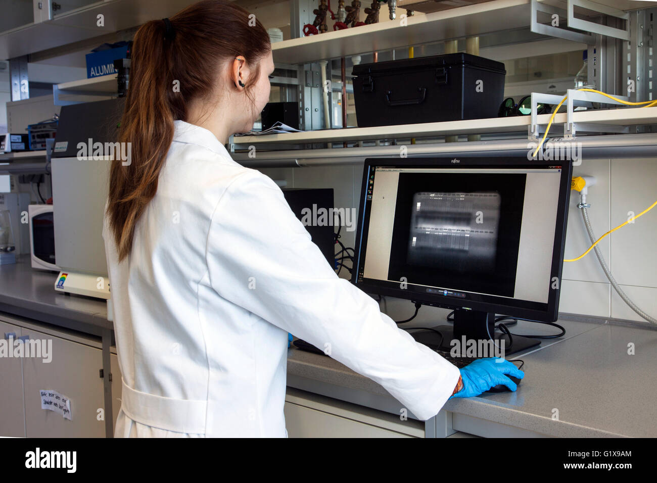 Scientific associate controlled DNA structures in a gene lab Stock