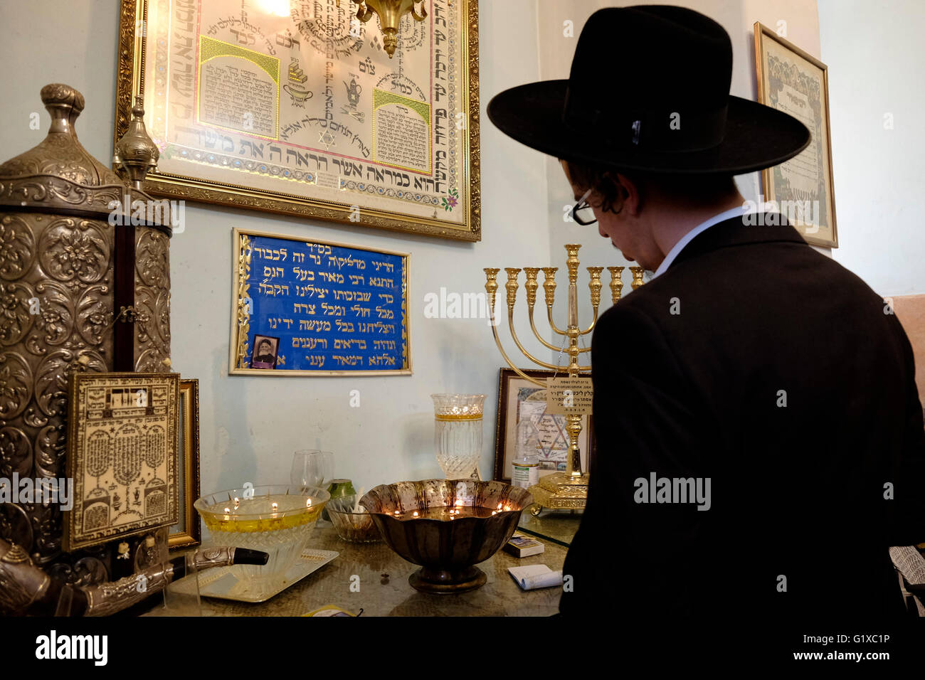 An ultra orthodox Jew praying inside the tomb of Rabbi Meir Baal Hanes who lived around 217 CE and is considered  a major Jewish pilgrimage site in Israel located in the city of Tiberias Israel Stock Photo