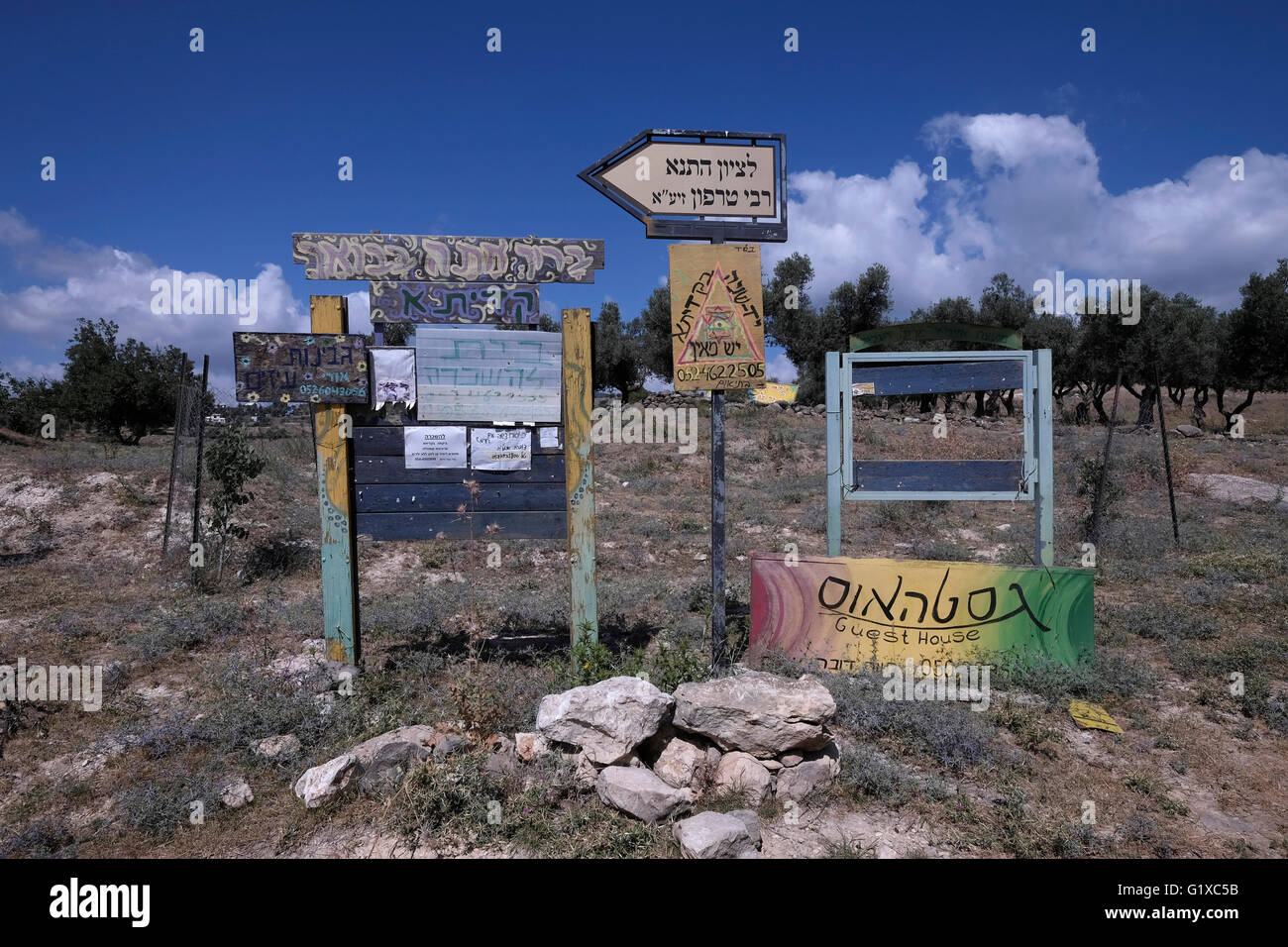 Stack of signs in Kadita an unrecognised community setlement in Upper Galilee Northern Israel Stock Photo