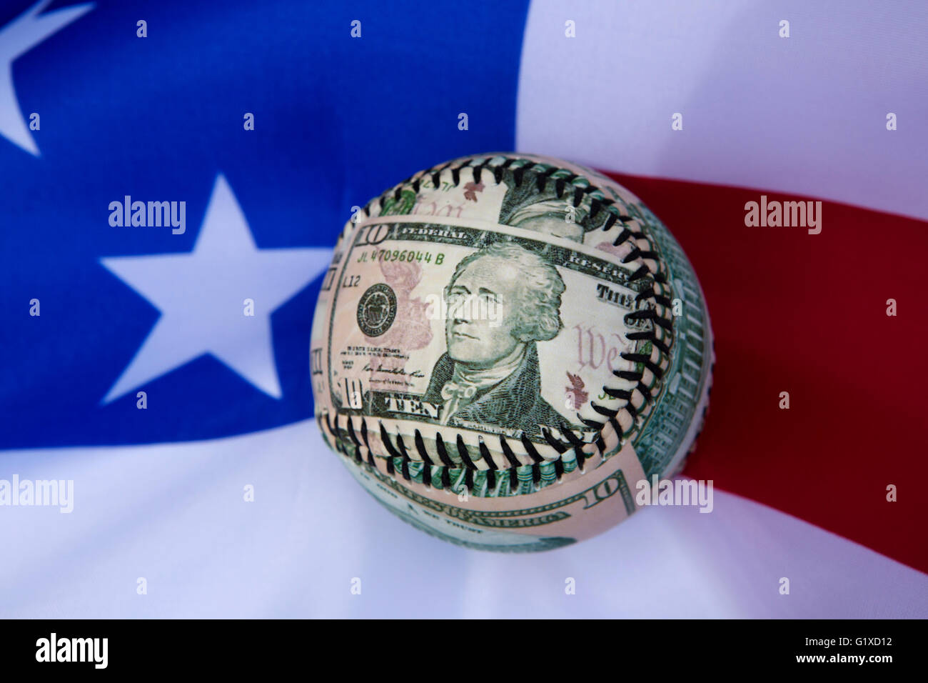 A baseball bearing the image of Alexander Hamilton, one of the Founding Fathers of the United States of America. Stock Photo