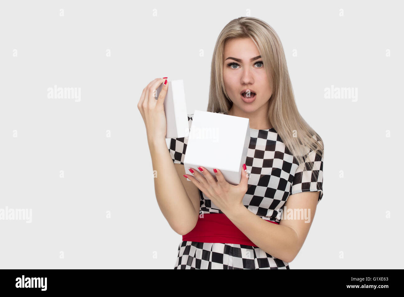 Young woman portrait holding gift Stock Photo - Alamy