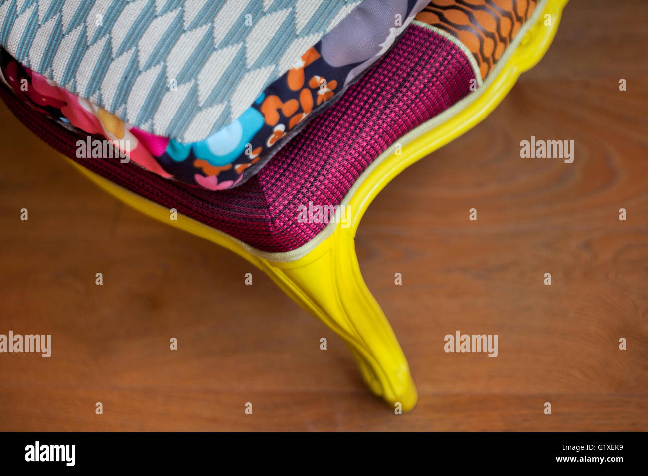 Close up of a stylish patchwork on a wooden floor Stock Photo