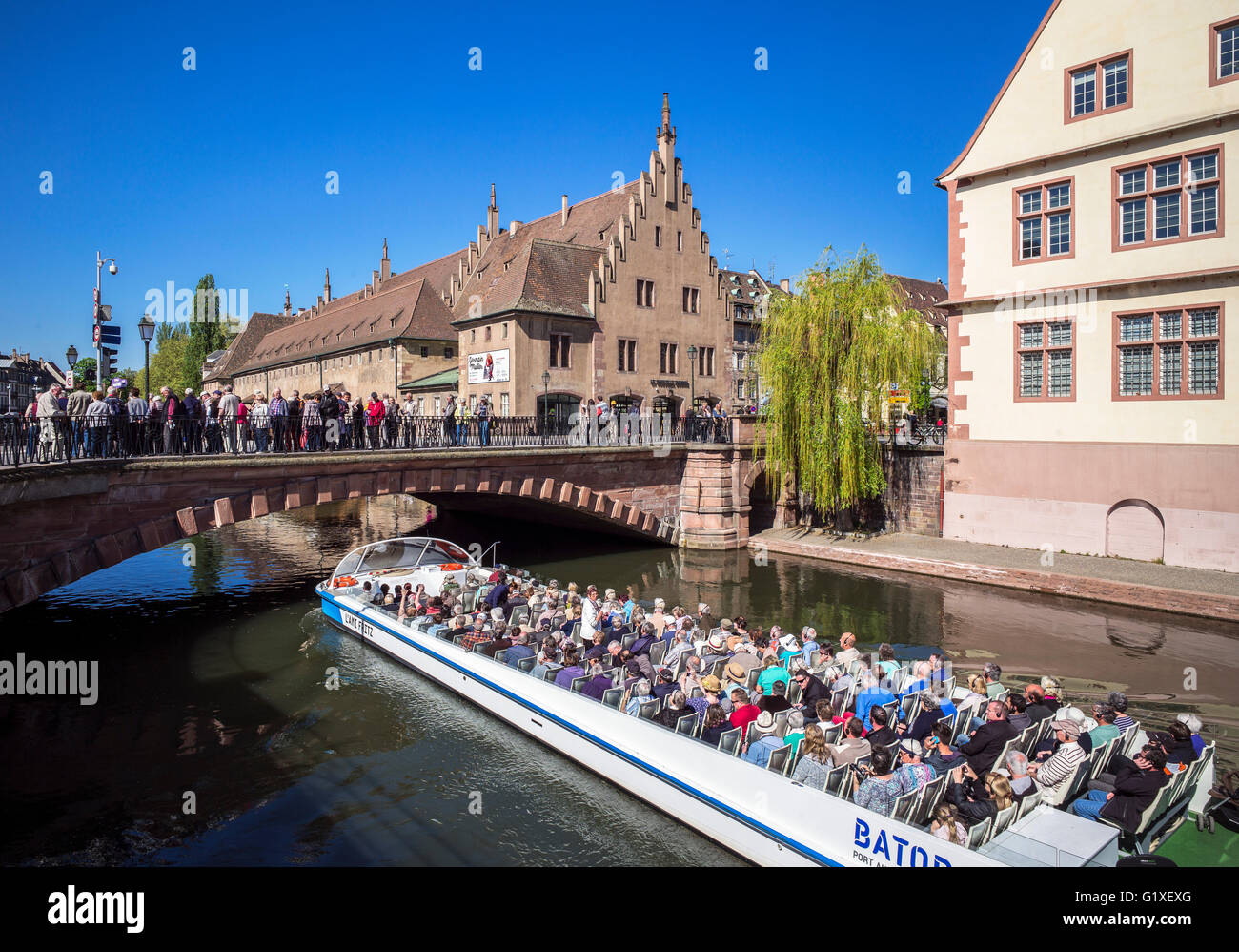 Sightseeing tour boat and "Ancienne Douane" former custom house