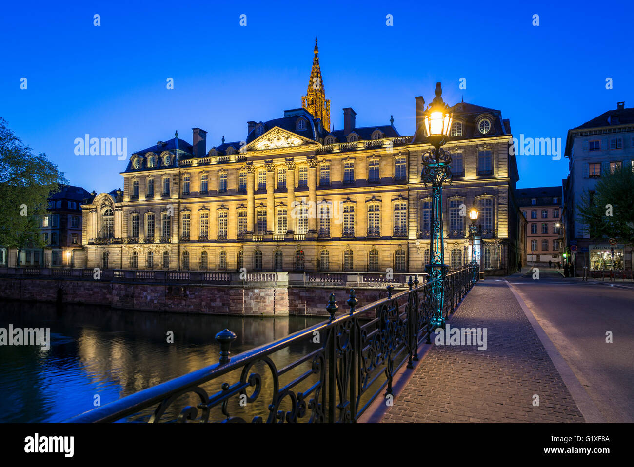 Shutterstock Palacio Rohan Palais Rohan, Rohan Palace 18th Century and cathedral's spire at night ...