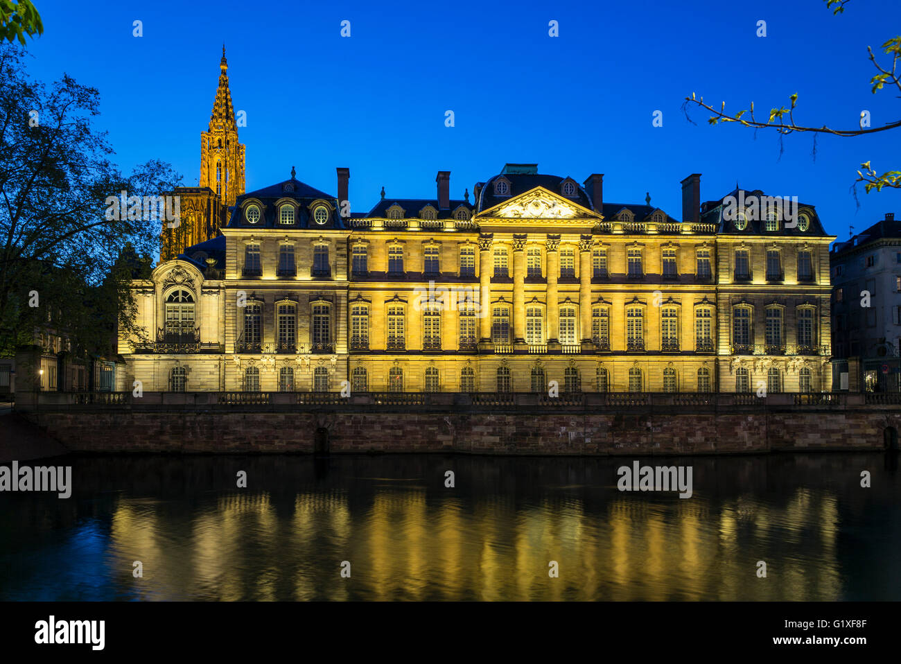 Shutterstock Palacio Rohan Palais Rohan, Rohan Palace 18th Century and cathedral's spire at night ...
